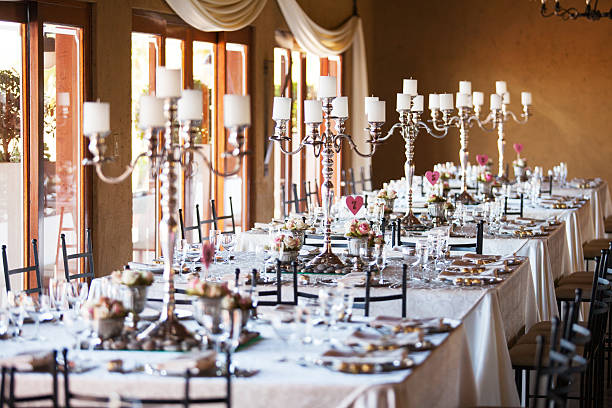 Hall at a wedding reception with decorated tables Hall at a wedding reception with decorated tables